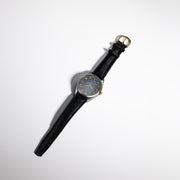 Todd Reed watch made with Stainless steel, sterling silver, 18 karat yellow gold, and raw diamonds(~.68ct) on a leather strap